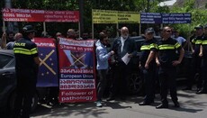 Rainbow flag torn up at a rally against LGBT propaganda in Georgian capital