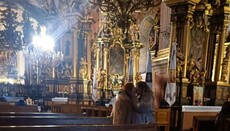 LGBT couples stage a kissing flash mob outside UGCC church in Lviv